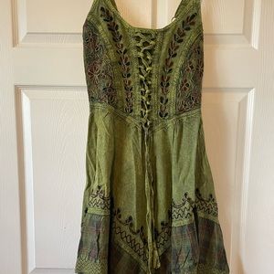 Green floral embroidered dress with tartan and asymmetrical hemline ties in back